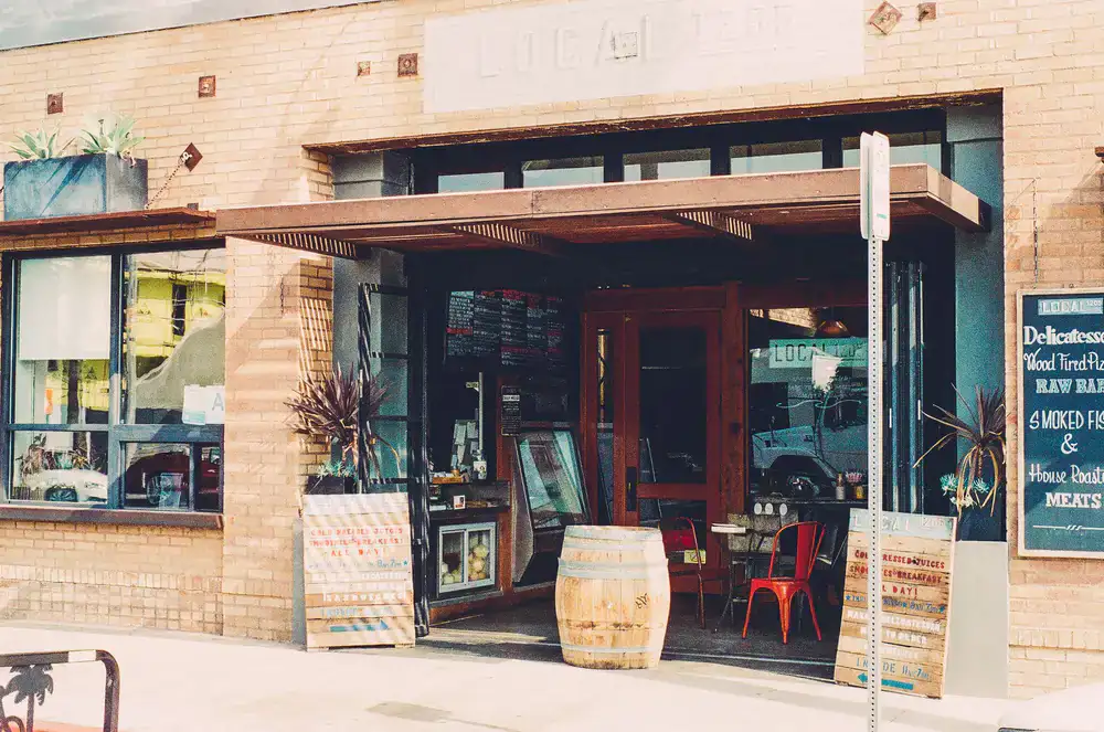 The welcoming exterior of the Board & Barrel deli